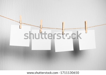 polaroid frame.Retro photo frames hanging on rope isolated on white background. real photo. four frames Foto stock © 