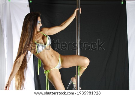 Pole Acrobat showing her moves