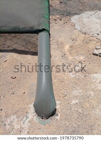 A pole of a barrier bend after wind storm 