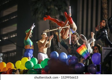 Pole Dancer Performing On A Parade Float Truck At The Las Vegas PRIDE Festival 2019 While Others Cheer. Captured In Downtown Las Vegas On 10-11-2019.