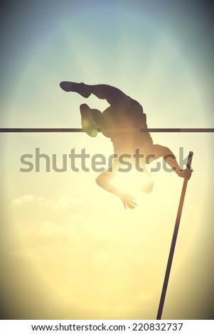 Pole vault over the bar with  back light. Vintage version