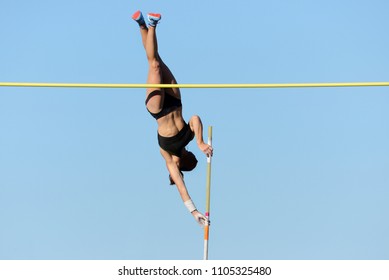 Pole vault. Player against the sky. - Shutterstock ID 1105325480
