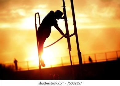 Pole Vaulter At Sunset