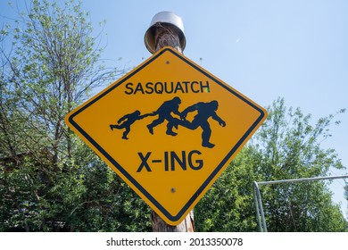 Polebridge, Montana - July 2, 2021: Funny Sign For A Sasquatch Bigfoot Crossing On A Sunny Day