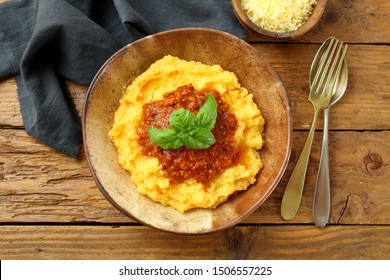polenta with ragu'  bolognese in rustic bowl