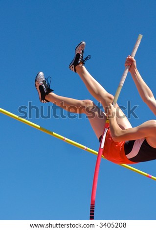 Polevaulter pulling over the pole vault crossbar