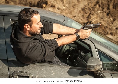 Police Agent And Bodyguard Training Action Gun Shooting From Car. Special Agent Team Weapons Training And Course On Outdoor Shooting Range