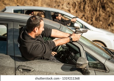 Police Agent And Bodyguard Training Action Gun Shooting From Car. Special Agent Team Weapons Training And Course On Outdoor Shooting Range