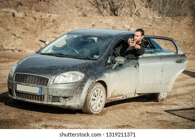 Police Agent And Bodyguard Training Action Gun Shooting From Car. Special Agent Team Weapons Training And Course On Outdoor Shooting Range