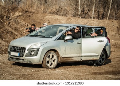 Police Agent And Bodyguard Training Action Gun Shooting From Car. Special Agent Team Weapons Training And Course On Outdoor Shooting Range