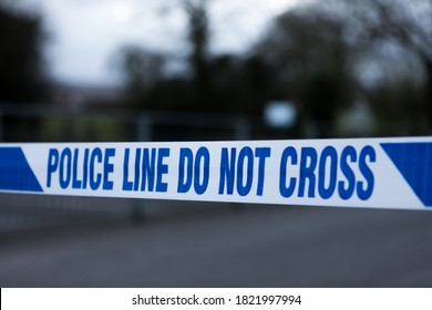 Police Barrier Tape In The UK At The Scene Of A Crime. Police Line Do Not Cross