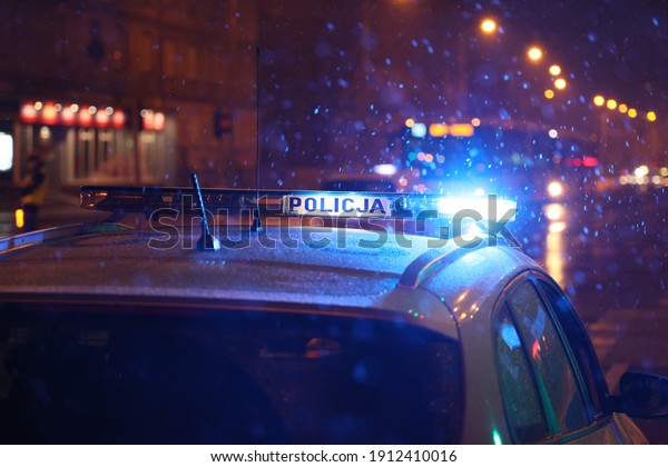 Police, blue car alarm\
lights.