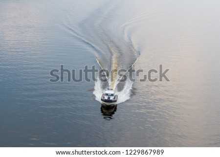 Police boat on the river in the evening