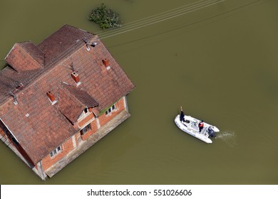 Police In Boat Oversees Flooded House