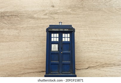 Police Call Box Isolated On Wooden Background. Tardis From Doctor Who. Top View With Copy Space For Your Text.