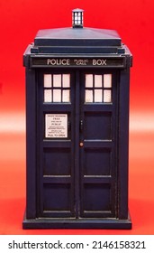 Police call box isolated on red background. Tardis from Doctor Who.