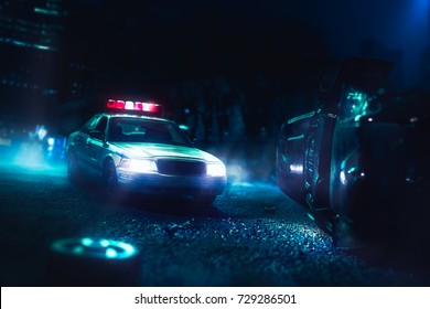 Police car arriving at a car crash scene