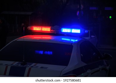 Police Car Blue And Red Lights In Night Street
