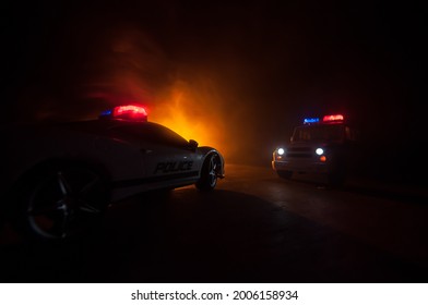 Police car chasing a car at night with fog background. 911 Emergency response police car speeding to scene of crime. Creative decoration. Selective focus