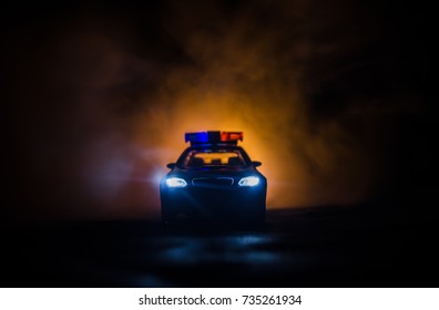 police car headlights at night