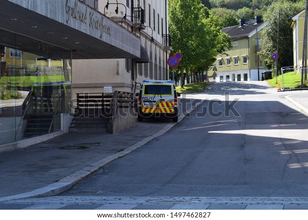Police car in\
the city street in the town city in sunny and summer season -\
Kongsvinger, Norway (13th august\
2019)