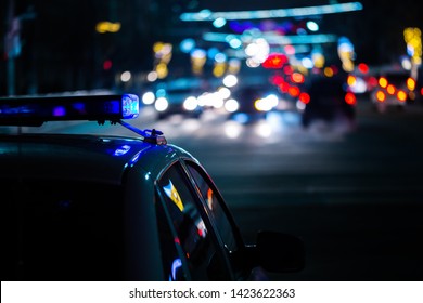 Police Car Lights At Night In City With Selective Focus And Boke Blur