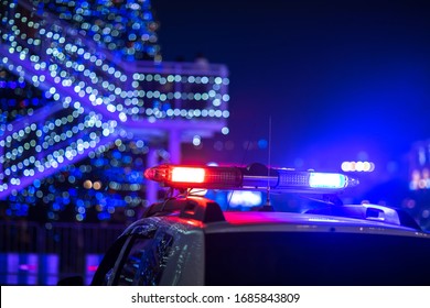 Police Car Lights In The Night City Background
