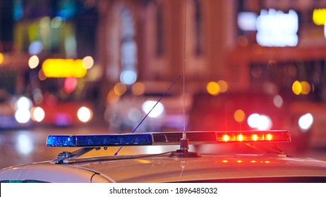 Police Car Lights At Night City Street. Red And Blue Lights. Road Traffic Accident. Evening Patrolling. Motion Blur.