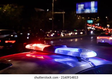 Police Car Lights At Night In City Background
