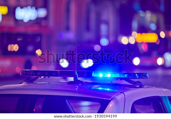 Police car lights at night\
city street. Red and blue lights. Road traffic accident. Evening\
patrolling