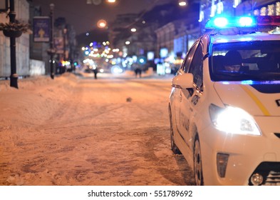 Police Car In Night Snow Storm