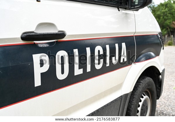 Police car on the street. Front view of a police\
car with the lettering \