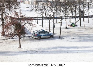 A Police Car Patrol In A City Park In Winter Season. Outdoor Activities In Safe Environment. Public Safety Concept. Stock Photography.