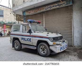 Police Car, In White, Red And Black Colors. Multan, Pakistan. 04. 10. 2022.