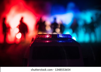 Police Cars At Night. Police Car Chasing A Car At Night With Fog Background. 911 Emergency Response Police Car Speeding To Scene Of Crime. Selective Focus