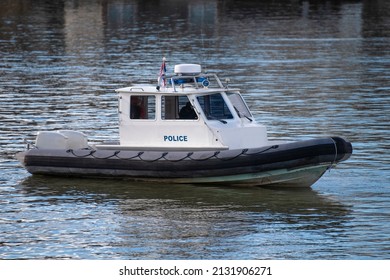 Police Coast Guard Motor Boat On Water Surface. Police Patrol Boat On The River In Action. Emergency Response