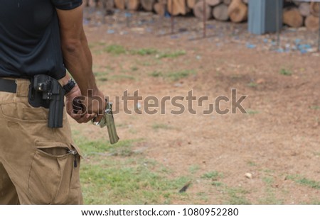 Police commando  operations practicing in fire pistol shooting.