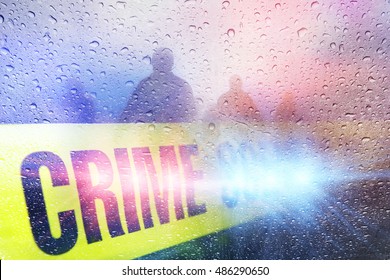 Police Crime Scene With Lights, Police Tape And Raindrops With Silhouettes In The Background