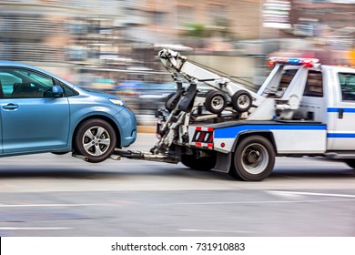 police department tow truck delivers the damaged vehicle