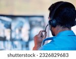Police dispatch, communication headset and man talking, speaking and consulting with security, monitor CCTV or callcenter. Conversation, support consultation and back of person chat about 911 service