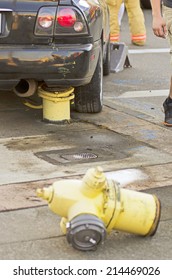 Police And Fire Equipment At The Scene Of A Single Car Accident That Knocked Over A Fire Hydrant,