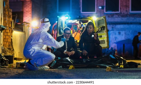 Police and Forensics Collaborating on Solving a Recent Case of Homicide. Smart Expert Detective Comparing a Bullet Shell Found on the Crime Scene to the Potential Murder Weapon. True Crime