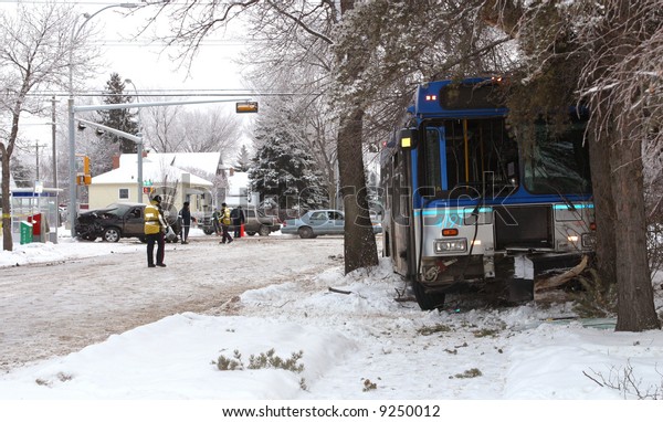 Police investigate a\
transit bus crash.