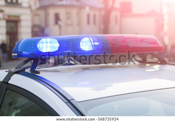 police light and
siren on the car in the
street