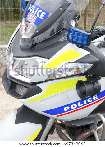 police motorcycle in france in the street white blue yellow and red
