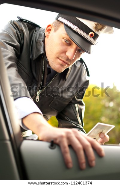 Police officer is doing\
a traffic check