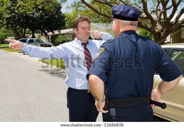 Police officer giving a roadside sobriety test to
a drunk driver.