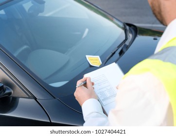 Police Officer Giving A Ticket Fine For Parking Violation