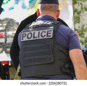 A Police Officer Intervening In A Public Demonstration