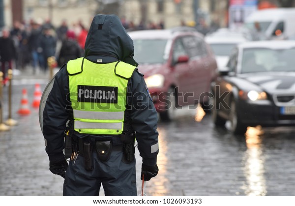 Police\
officer managing road traffic, Lithuania,\
Europe
